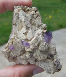 Amethyst crystals on a feldspar crystal cluster matrix , Brandberg , Namibia